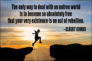 Silhouette of a child jumping cliff with sunset background